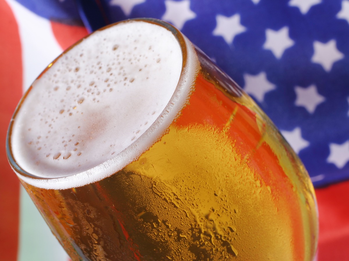 Beer with an American flag in the background.